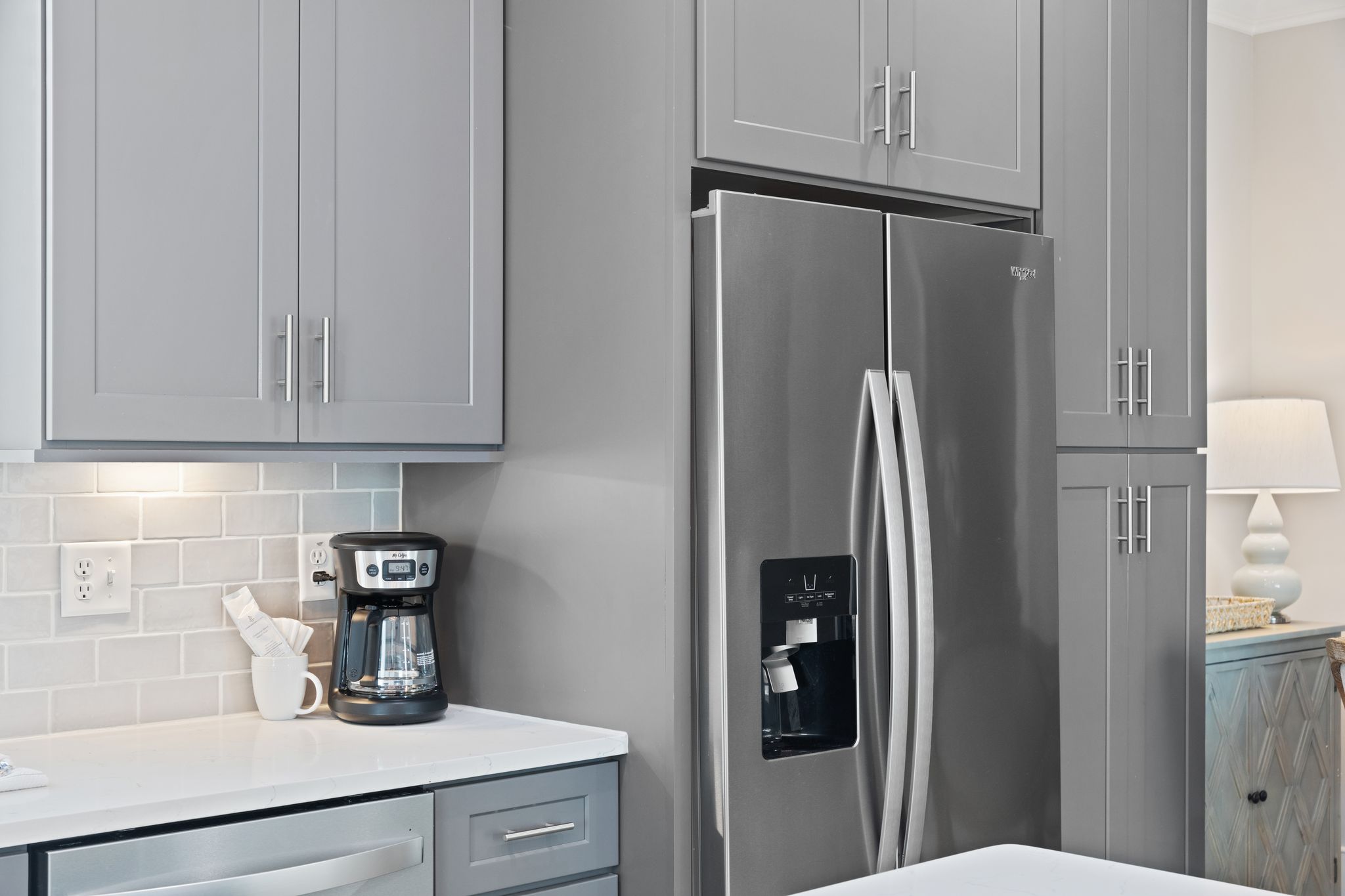 Kitchen with Full Height Panty Cabinets Adjacent to Fridge